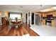 An open living space with hardwood floors, dining table, a kitchen and plenty of natural light, great for entertaining at 2430 Westwood Dr, Longwood, FL 32779