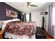 Relaxing main bedroom with ceiling fan, floral comforter, and stylish design at 2430 Westwood Dr, Longwood, FL 32779