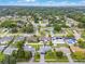 Aerial view showing the property in a suburban neighborhood with mature trees and well-kept lawns at 2932 Carriage Dr, South Daytona, FL 32119