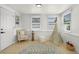 Bright bedroom with hardwood floors, white walls, natural light, and a charming teepee at 2932 Carriage Dr, South Daytona, FL 32119