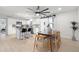Bright, remodeled kitchen with white cabinets, island with bar seating, and a dining area with sliding barn doors at 2932 Carriage Dr, South Daytona, FL 32119