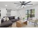 Bright living room with modern finishes, stylish furnishings, and a large window showcasing the outdoor view at 2932 Carriage Dr, South Daytona, FL 32119
