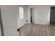 Bright bedroom with gray flooring, white walls, and a window with natural light at 311 Osceola Ave, Lake Wales, FL 33853