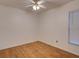 Bright, airy bedroom with hardwood floors, ceiling fan, and neutral walls for a peaceful retreat at 5123 Pineland Ave, Port Orange, FL 32127