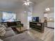 Inviting living room connects seamlessly to the kitchen with modern appliances and an archway entrance at 5123 Pineland Ave, Port Orange, FL 32127