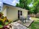 A patio with outdoor seating near a garden at 5123 Pineland Ave, Port Orange, FL 32127