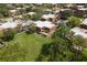 Expansive aerial view of the community showcasing well-manicured lawns and mature trees surrounded by residential properties and parking at 5365 Elm Ct # 331, Orlando, FL 32811