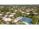 This aerial view shows community amenities like the pool and tennis courts nestled amongst lush landscaping and townhome residences at 5365 Elm Ct # 331, Orlando, FL 32811