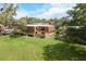 Aerial view of the property, showing lush green lawns, mature trees, and multiple units at 5365 Elm Ct # 331, Orlando, FL 32811