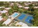 Aerial view of community amenities including a pool and tennis courts, perfect for an active lifestyle in a serene residential setting at 5365 Elm Ct # 331, Orlando, FL 32811
