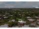This aerial shows the unit's proximity to Mall at Millenia and Universal in a lush green community at 5365 Elm Ct # 331, Orlando, FL 32811