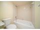 Clean bathroom featuring a tub with shower and a white toilet at 5365 Elm Ct # 331, Orlando, FL 32811
