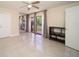 Spacious bedroom featuring tile floors, ceiling fan, sliding glass doors, and built-in shelving at 5365 Elm Ct # 331, Orlando, FL 32811