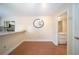 Bright dining area adjacent to a bathroom and an open kitchen with breakfast bar at 5365 Elm Ct # 331, Orlando, FL 32811