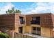 Townhome with a private patio, balcony, and bright exterior offers a cozy and welcoming atmosphere for relaxation and outdoor enjoyment at 5365 Elm Ct # 331, Orlando, FL 32811