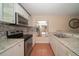 Well-equipped kitchen with stainless steel appliances, granite counters, and stylish backsplash at 5365 Elm Ct # 331, Orlando, FL 32811