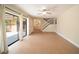Bright living room with sliding doors leading to the patio, and staircase to the second floor at 5365 Elm Ct # 331, Orlando, FL 32811