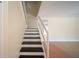 View of the home's staircase featuring carpeted steps, leading to the upper level at 5365 Elm Ct # 331, Orlando, FL 32811