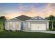 Charming single-story home featuring a two-car garage and well-manicured lawn, perfect for suburban living at 6015 Tree Crossing Ln, St Cloud, FL 34771
