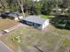 Expansive aerial view of the home with a long driveway and surrounding greenery at 611 S Montgomery Ave, Deland, FL 32720