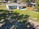 Aerial view of a home with a new patio and a spacious backyard with modern wooden fence at 611 S Montgomery Ave, Deland, FL 32720