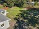 Aerial view of a spacious backyard featuring lush grass and a modern wooden fence at 611 S Montgomery Ave, Deland, FL 32720