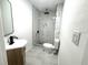 Bathroom features a stylish vanity and a beautifully tiled walk-in shower at 611 S Montgomery Ave, Deland, FL 32720