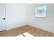 Bedroom features hard wood floors, a door and a window at 611 S Montgomery Ave, Deland, FL 32720