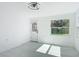 Room featuring a door, window, and tile flooring at 611 S Montgomery Ave, Deland, FL 32720