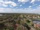 Scenic aerial view of a residential community with a golf course, lakes, and lush green trees at 643 Cricklewood Ter, Lake Mary, FL 32746