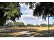 View of baseball field in the community with shaded areas for spectators at 643 Cricklewood Ter, Lake Mary, FL 32746