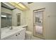 Bright bathroom with garden-view access, and adjacent shower and toilet, provides a serene experience at 643 Cricklewood Ter, Lake Mary, FL 32746