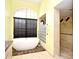 Relaxing bathroom featuring a soaking tub, walk-in shower, and a bright window at 643 Cricklewood Ter, Lake Mary, FL 32746
