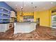 Bright kitchen with an island, updated cabinets, stainless steel appliances, and lots of natural light at 643 Cricklewood Ter, Lake Mary, FL 32746
