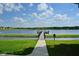 Scenic view of a lakeside pier perfect for fishing and relaxation in the community at 643 Cricklewood Ter, Lake Mary, FL 32746