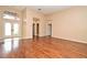 Spacious living room featuring hardwood floors, neutral paint, and arched doorways that create an airy atmosphere at 643 Cricklewood Ter, Lake Mary, FL 32746