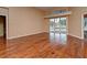 Bright living room with hardwood floors and sliding glass doors view of the pool and backyard at 643 Cricklewood Ter, Lake Mary, FL 32746