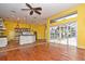 Open concept living and kitchen area features a ceiling fan and a lot of space at 643 Cricklewood Ter, Lake Mary, FL 32746