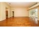 Large living room with hardwood floors, neutral paint, and glass sliding doors leading to the backyard at 643 Cricklewood Ter, Lake Mary, FL 32746