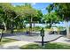 Community playground with swings, slides, and various play structures for to enjoy at 643 Cricklewood Ter, Lake Mary, FL 32746