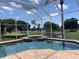 Screened pool with brick deck offers stunning views of the golf course and nearby lake at 643 Cricklewood Ter, Lake Mary, FL 32746