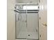 Bright, tiled shower with clear glass doors and convenient built-in seat at 643 Cricklewood Ter, Lake Mary, FL 32746