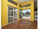 Bright sunroom with access to a beautiful pool area through french doors at 643 Cricklewood Ter, Lake Mary, FL 32746
