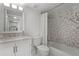 Bathroom featuring modern fixtures, neutral vanity, and a tub with decorative tile surround at 1100 Delaney Ave # F407, Orlando, FL 32806
