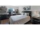 Cozy bedroom with natural light, a sleek desk area and a serene atmosphere at 1100 Delaney Ave # F407, Orlando, FL 32806