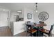 A lovely dining area situated just off the kitchen and living room with a modern pendant light at 1100 Delaney Ave # F407, Orlando, FL 32806
