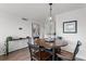 Cozy dining area features an attractive pendant light fixture, suitable for any decor at 1100 Delaney Ave # F407, Orlando, FL 32806