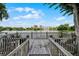 Scenic view of the lake and cityscape from the wooden deck, creating a relaxing outdoor space at 1100 Delaney Ave # F407, Orlando, FL 32806