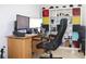 Well-lit office with a multi-monitor setup and a convenient storage unit at 115 Willowbay Ridge St, Sanford, FL 32771
