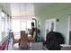 Screened in patio with outdoor seating, a fan, and a view of the backyard at 115 Willowbay Ridge St, Sanford, FL 32771
